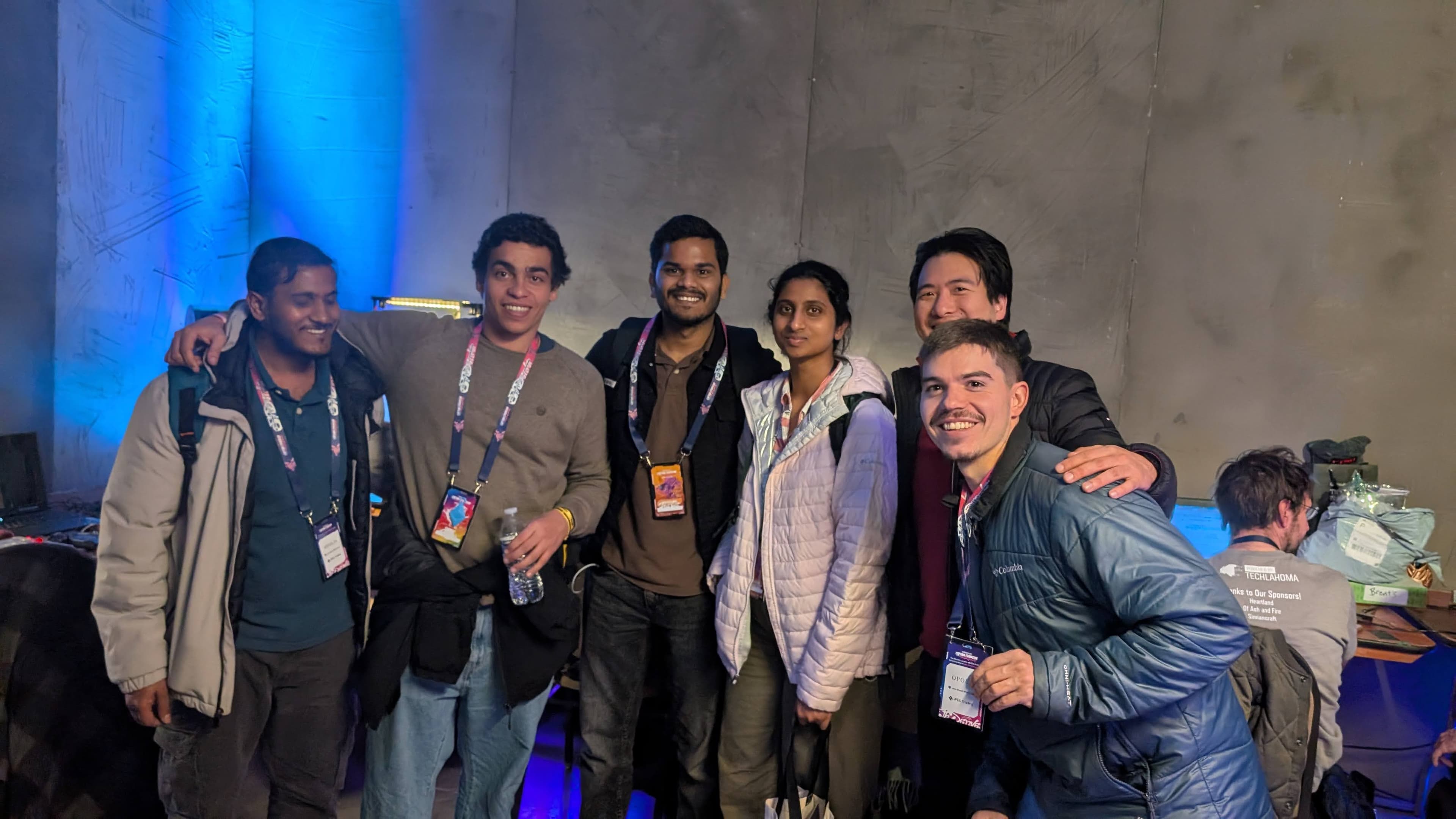 Event team celebrating together under the venue lights